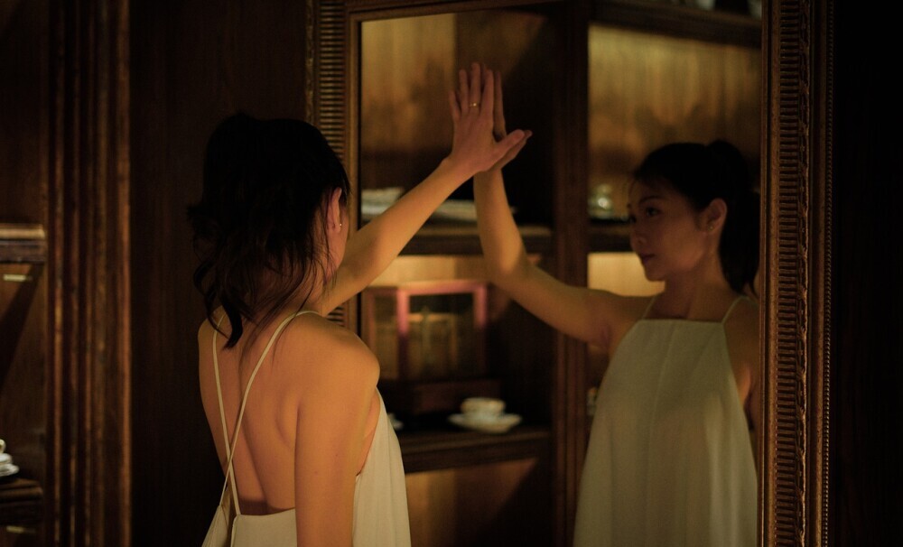 woman looking in a mirror