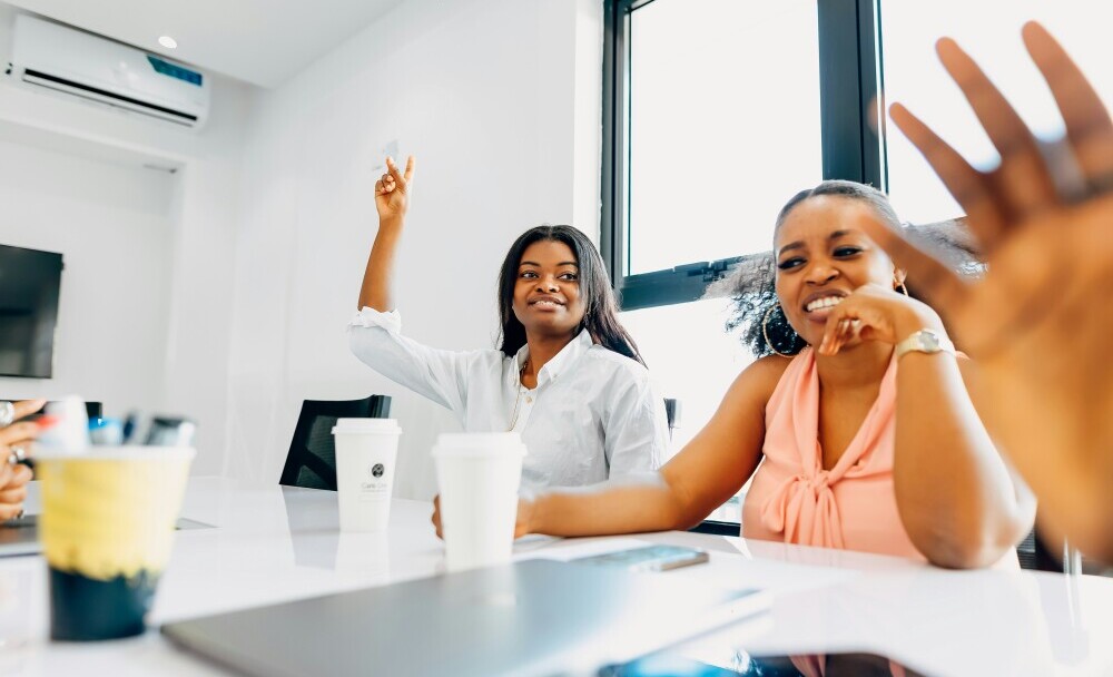 happy work colleagues laughing