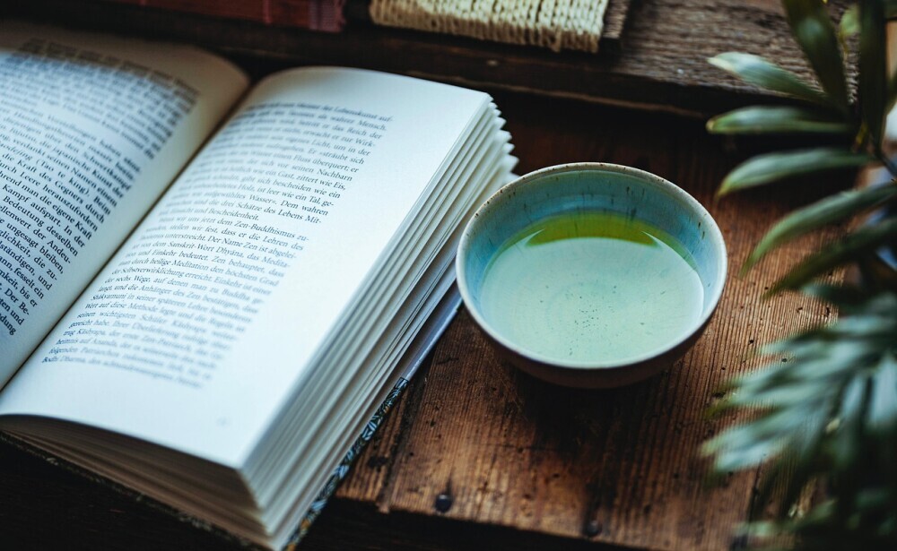 Image of a book and a cup of green tea