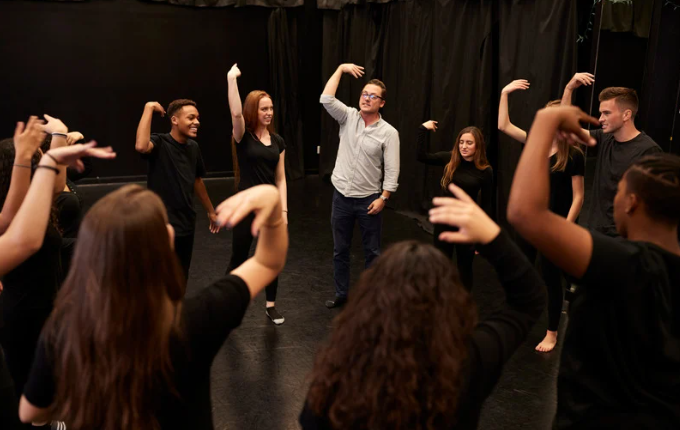 students shaking their hands as part of a drama warm-up