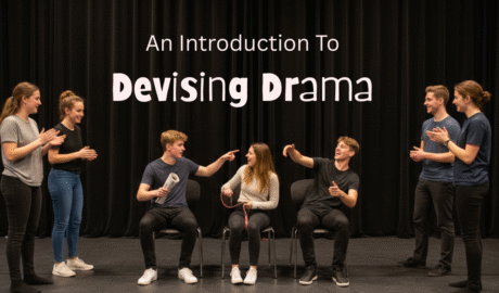 A group of secondary drama students performing a devised scene on stage, with two students seated and others reacting around them. The title “An Introduction to Devising Drama” appears above the group against a black curtain backdrop.